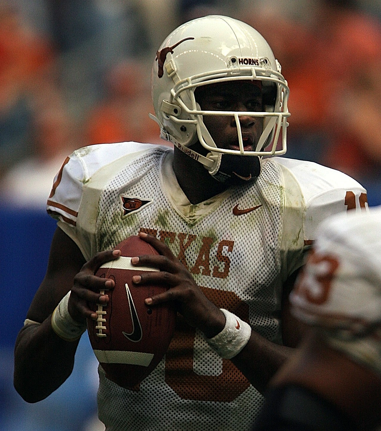 Vince Young in a Texas Longhorns football uniform holding a football.