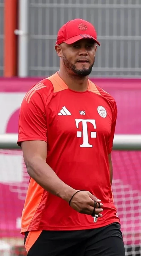 Vincent Kompany in Bayern Munich training gear and cap on the training ground