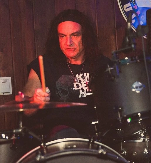 Vinny Appice performing on drums during a stage photo portrait.