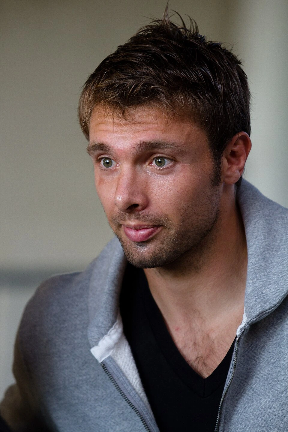 Portrait photo of Vincent Clerc, the rugby player, looking slightly to the side in a gray jacket.